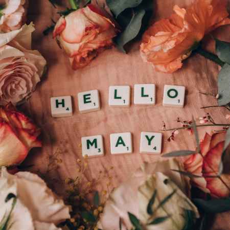 scrabble tiles surrounded by beautiful flowers